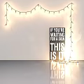 Decorative String Lights Hanging In Arch Shape With Black Sign And Motivational Message