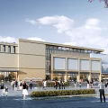 Modern Commercial Complex With Glass Facade Landscaped Plaza And Busy Pedestrian Area