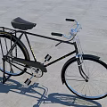 Classic Vintage Bicycle With Black Frame Silver Handlebars And Rear Rack