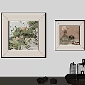 Framed Artworks On White Wall With Tabletop Candles And Decorative Pinecones