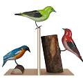 Colorful Bird Figurines In Green Blue Orange And Red On Wooden Log Stands