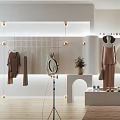 Luxe Essentials Clothing Store Modern Interior With Circular Window Hanging Clothes And Display Stand