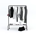 Hanging Clothes on Metal Rack with Shoes and Black Bag