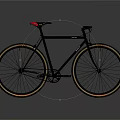 Classic Black Bicycle Featuring Gold Rims Red Seat Sleek Frame And Stylish Design