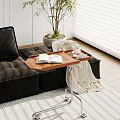 Wooden Side Table With Metal Stand By Black Sofa With Open Book Coffee Cup Tray