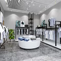 Modern Clothing Store Interior With White Shirts Round Display Table Green Plant And Black Racks