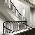 Curved Staircase With Black Iron Railing And White Wall Interior Design