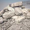 Stacked Stone Blocks And Wooden Debris With Rebar In Construction Site