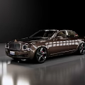 Luxury Brown Sedan With Red Accent Rims In Modern Showroom Environment
