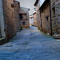 Modern View Of Historic Stone Alley With Cobblestone Pathway