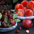 Fresh Ripe Red Apples Cherries Peaches And Pomegranate With Purple Flowers And Fresh Leaves