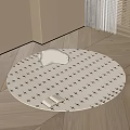 Round Rug with Black Cross Patterns White Cushion and Open Book on Light Wooden Floor