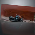 Classic Black Motorcycle Parked Against Red Brick Wall With Reflective Ground Surface