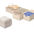 Folded Clothes Organized In Beige And Blue Storage Bins For Home Storage