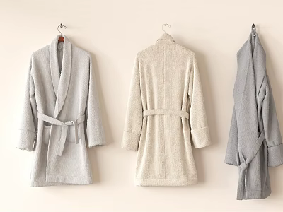 Plush Towel Bathrobes Hanging On Wall In Light Gray Beige And Dark Gray 3d model