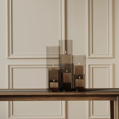 Elegant Decorative Ornament Set with Glass Candle Holders of Varying Heights on Wooden Table 3d model