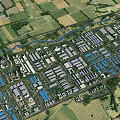 Aerial View of Industrial Factory Complex Surrounded by Farmland Green Areas and River