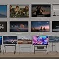 Multiple TVs Showcase Various Screen Images With Scenery And Movie Content In Showroom