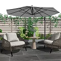 Wicker Outdoor Sofa Set With Umbrella Plants And Side Table On Slate Floor