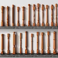 Collection Of Wooden Balusters With Different Decorative Designs On Marble Shelves