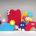 Colorful Felt Floral Art Installation With Flower Shapes Eye Elements Arch Decorations And Balloons