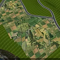 Beautiful Aerial Scenery Of Patchwork Rural Farmland With Winding Country Roads And Lush Green Forests