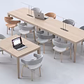 Modern Wooden Conference Table With Laptops Table Lamps And Multi Colored Chairs