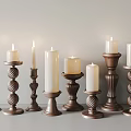 Various Designed Brown Candle Holders With White Lit Candles For Home Decor
