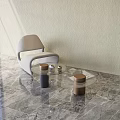 Light Gray Upholstered Accent Chair With Glass Coffee Table On Marble Floor