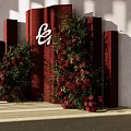 Floral Installation With Red Backdrop Column Structures Red Green Flowers And White Logo 3d model