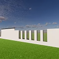 White Feature Wall with Circular Perforated Geometric Pattern Set Against Green Lawn and Blue Sky