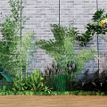 Lush Green Plants Including Bamboo Ferns And Flowering Tree By Brick Wall On Wooden Floor