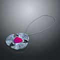 Elegant Silver Chain Necklace Featuring Red Gemstone And Intricate Decorative Patterns
