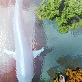 Stunning Water Fountain With Green Trees And Sunlight Reflection On Water Surface