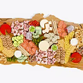 Delicious Assorted Food Platter on Wooden Tray with Meats Cheeses Vegetables and Fruits
