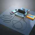Vintage Computer Console Setup With Connected Controllers And Yellow Game Cartridge