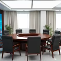 Modern Conference Room Interior With Round Table Black Chairs Large Screen Windows And Plants
