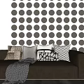 Modern Throw Pillows on White Sofa Against Gray Polka Dot Wall with Diverse Patterns 3d model