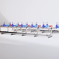 Industrial Equipment Featuring Stainless Steel Pipe System With Blue Valves And Red Labels
