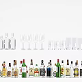 Various Alcohol Bottles and Wine Glasses Displayed in Assorted Colors Shapes and Sizes
