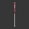 Red and White Swirl Lollipop on White Stick Against Dark Background