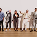 People Standing Together With Different Outfits Pointing Holding Coffee Cup Against White Wall Wooden Floor