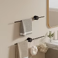 Gray And Beige Soft Towels On Black Towel Rack With Wooden Ends In Bathroom