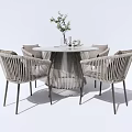 Modern Rattan Round Table and Chair Set With Metal Frame and Potted Plants