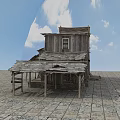 Old Western Wooden Building With Balcony Stairs And Stone Ground Under Blue Sky