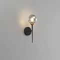 Modern Wall Light With Transparent Spherical Shade Black Base Gold Accent And Soft Lighting Effect