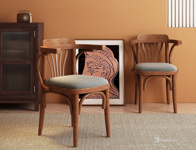 Wooden Dining Chairs With Gray Padded Seats Against Warm Brown Wall Near Dark Cabinet And Artwork 3d model 