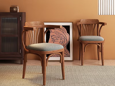 Wooden Dining Chairs With Gray Padded Seats Against Warm Brown Wall Near Dark Cabinet And Artwork 3d model