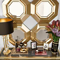 Gold Console Table With Black Lampshade Lamp Flower Vase Photo Frames And Geometric Mirror Wall