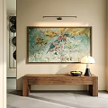 Abstract Painting on Beige Wall with Wooden Table Lamp Fruit Bowl and Black Circular Decorations